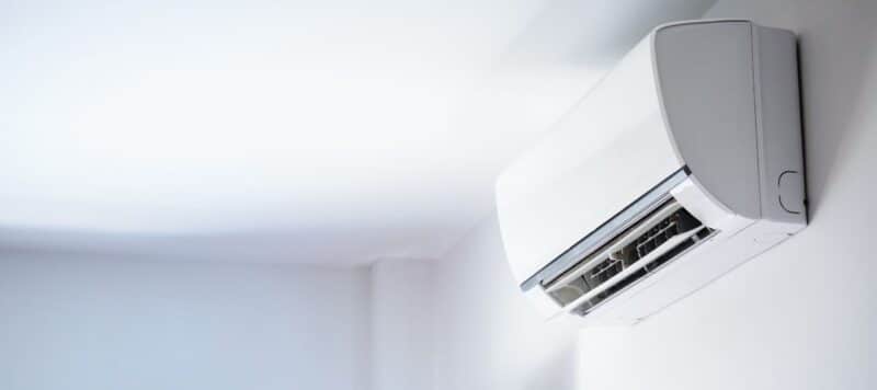 closeup of a ductless unit positioned on a white wall